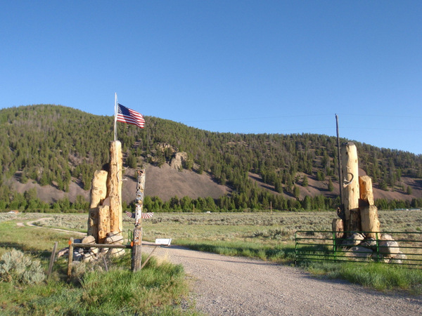 We're looking west at a ranch entryway.